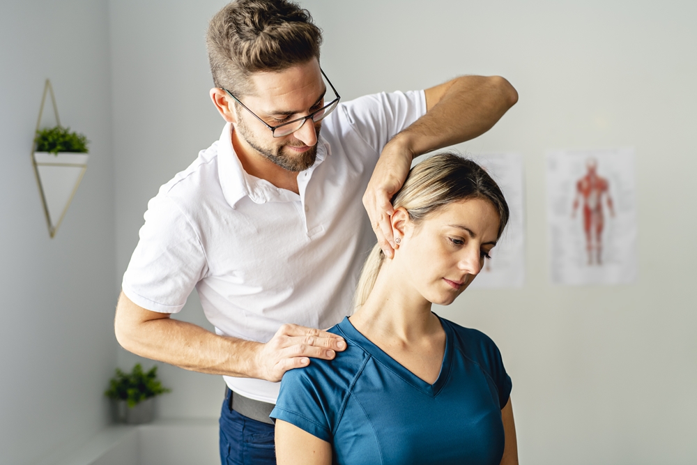 Modern-rehabilitation-physiotherapy-worker-with-senior-client Home