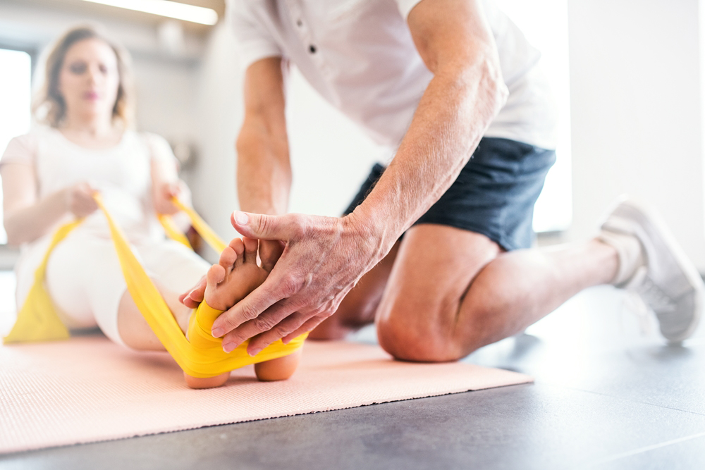 Modern-rehabilitation-physiotherapy-worker-with-senior-client About Us